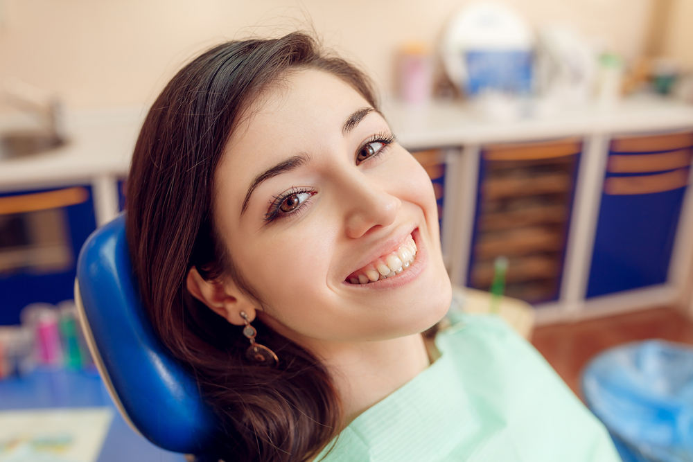 Confident Smile After Dental Implant Treatment – Dental Implants in Palm Springs A patient smiling comfortably in a dental chair, reflecting restored confidence, natural aesthetics, and long-lasting results from dental implants in Palm Springs – Dental Implants in Palm Springs